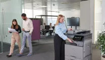 Person using printer in office